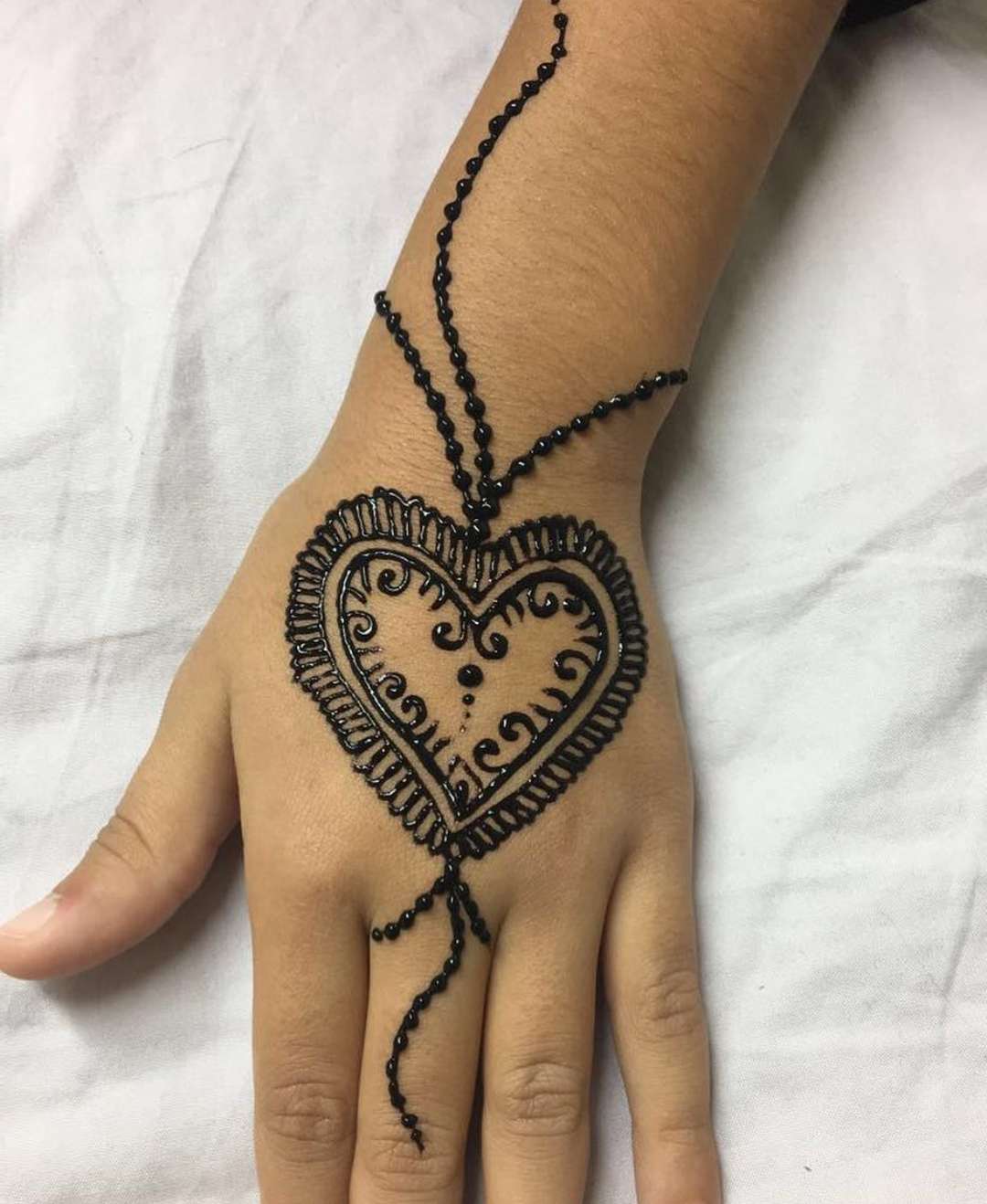 Back hand Heart mehndi design