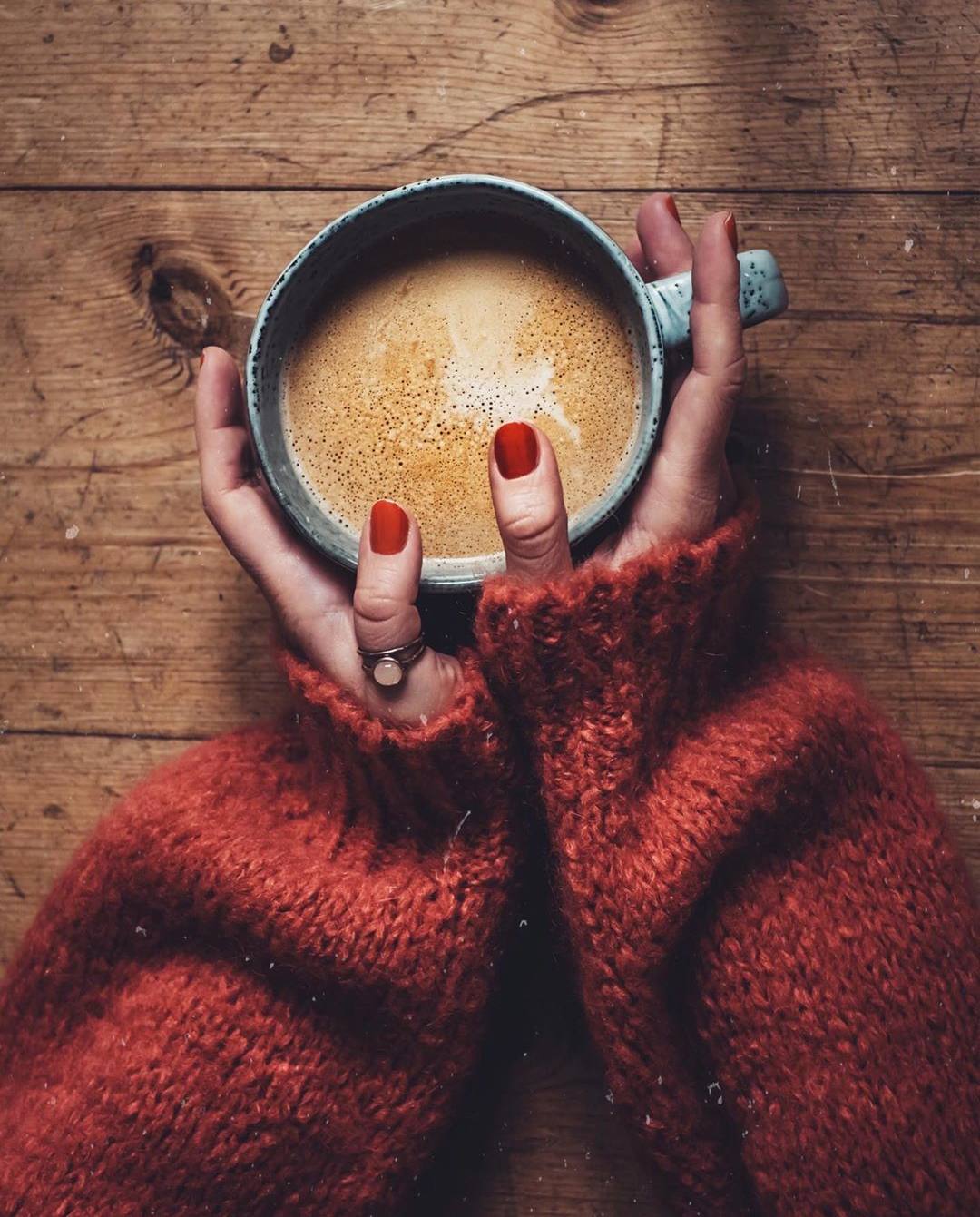 Girls holding Coffee Mug With Red Nail paint